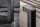 Freischwinger Stuhl Taupe Schwarz Stoff Metall mit Armlehne